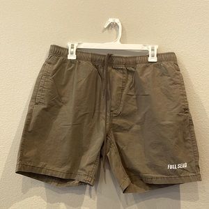 Men’s shorts size 34 in a khaki/green-ish color. Elastic waist with drawstring.